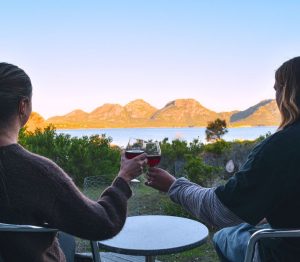 Careers. Couple drinking wine at Edge of the Bay Resort
