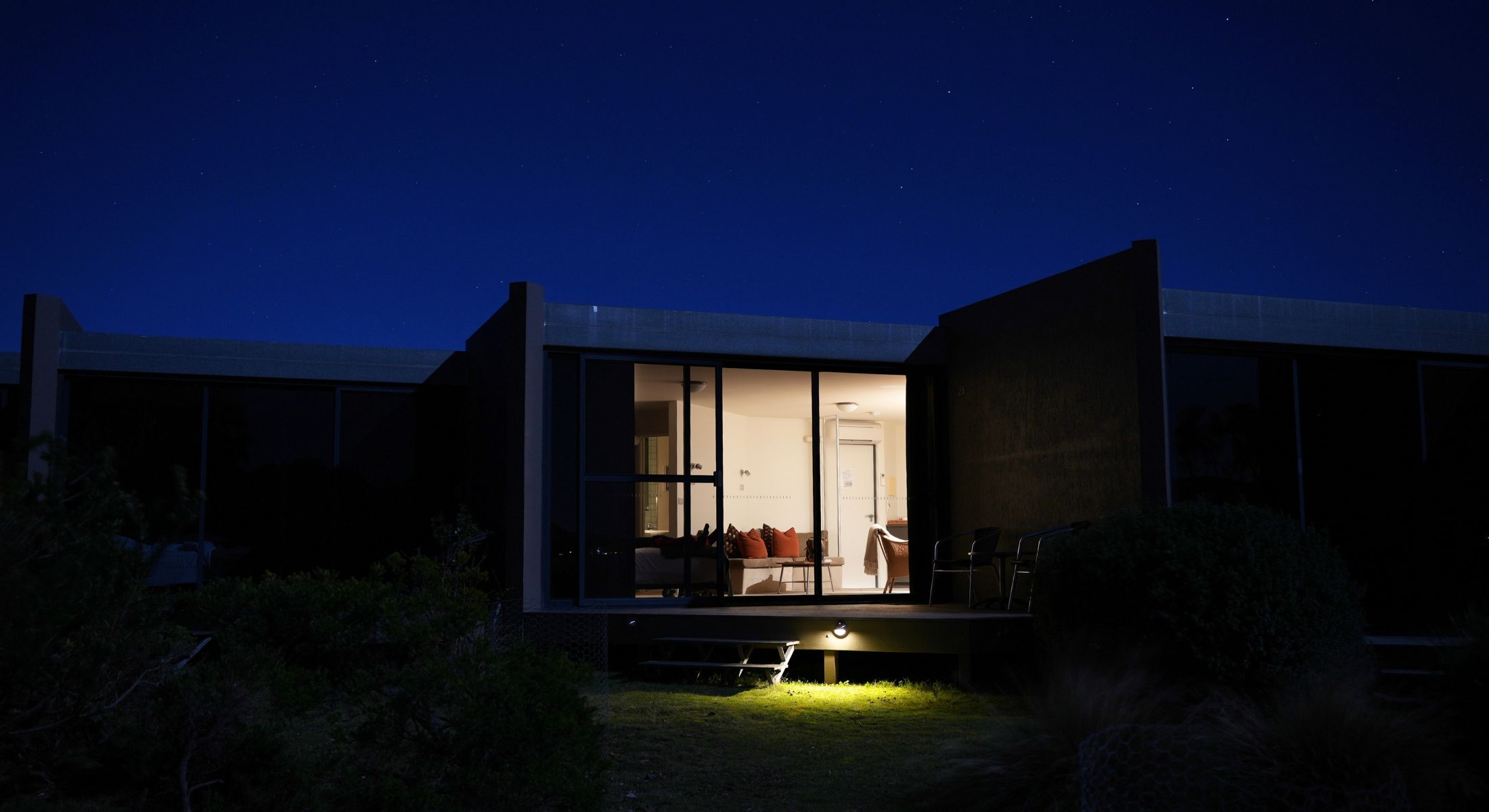 Night view of Ocean View Studio at Edge of the Bay