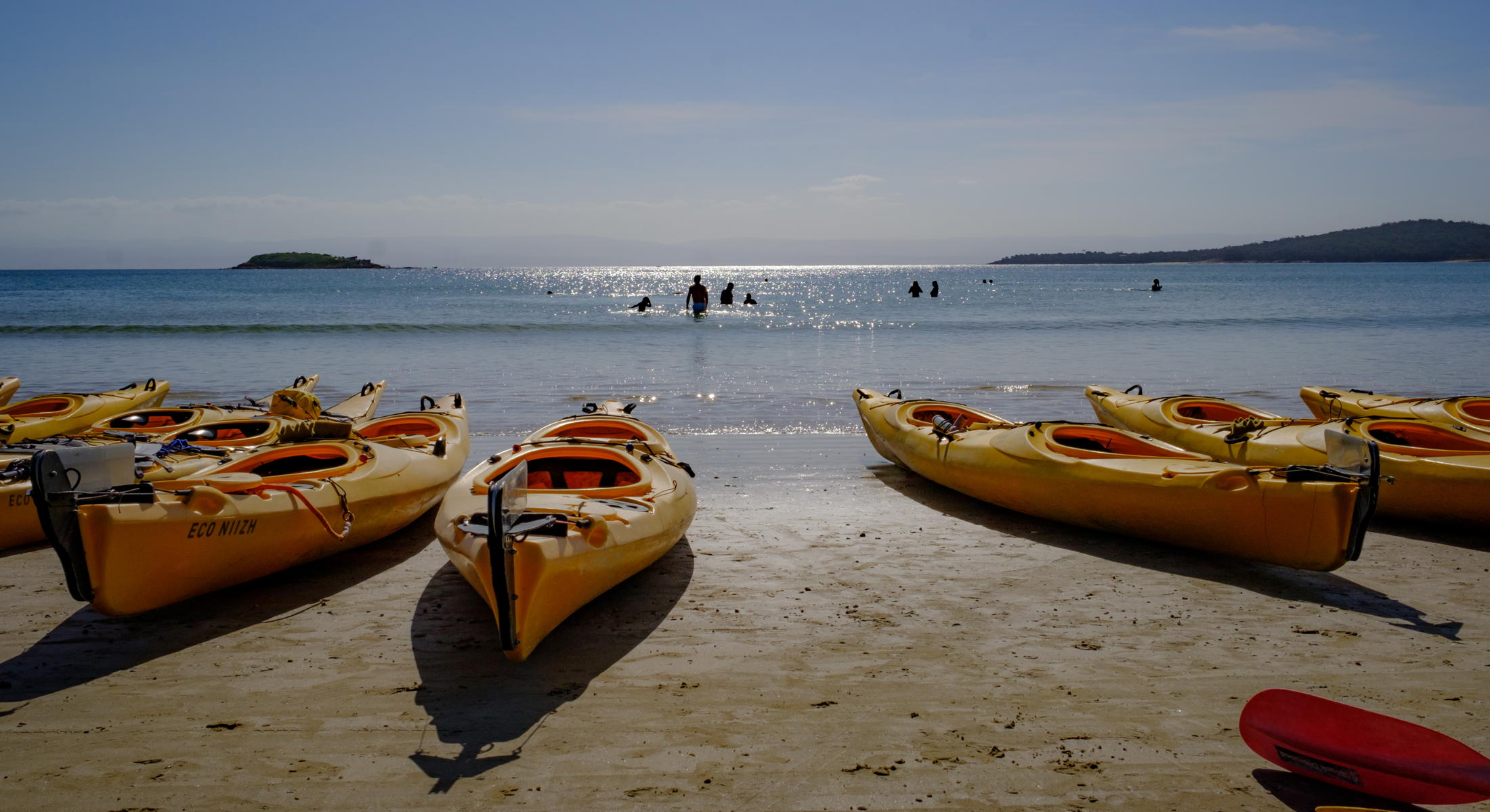 Kayaks on beach for Freycinet paddle